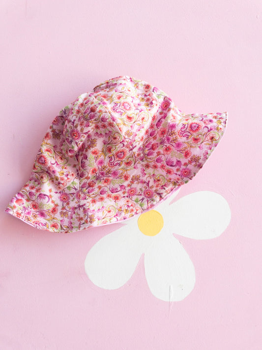 Cappellino fiorellini rosa